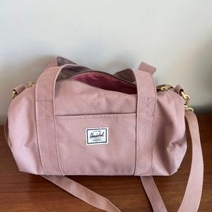 Pink Herschel mini duffel bag